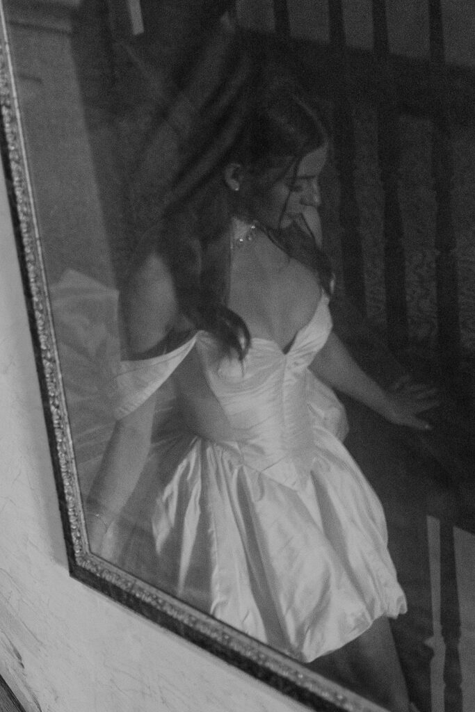 Bride in a J. Andreatta Bridal Couture gown reflected in a mirror at the Gage Hotel in Marathon, Texas.
