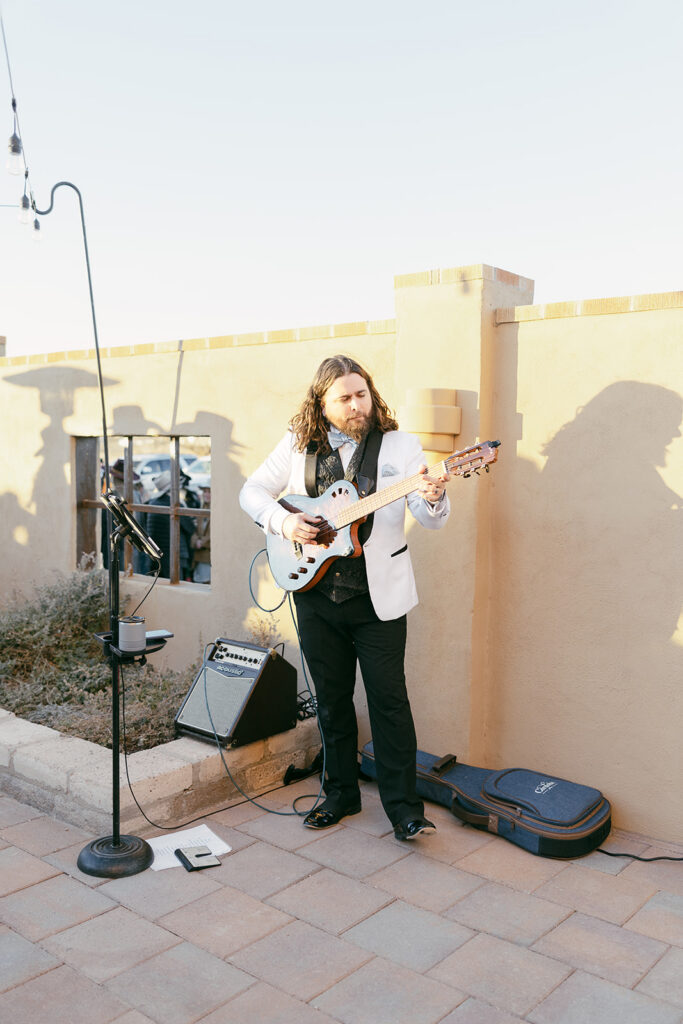 Plush Party Band guitarist playing during cocktail hour at the Gage Hotel in Marathon, Texas.